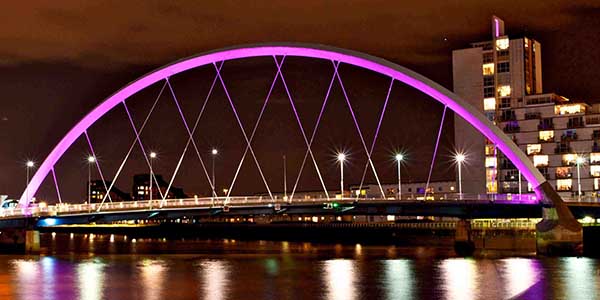 Clyde arc bridge lit up purple at night. Clyde arc bridge lit up purple at night.