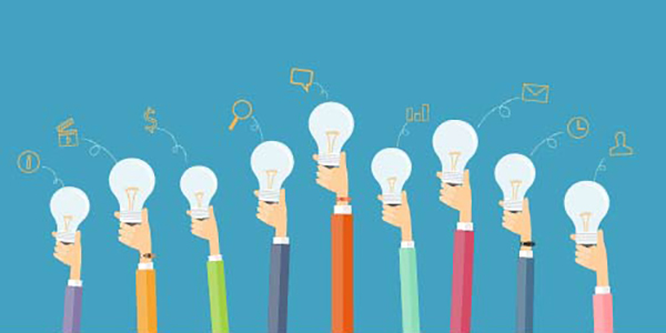 Hands holding light bulbs